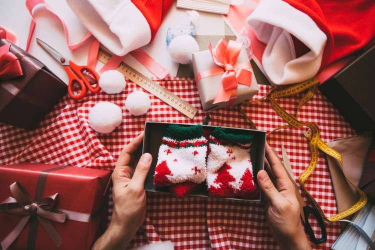 wrapping presents together is a fun christmas date idea