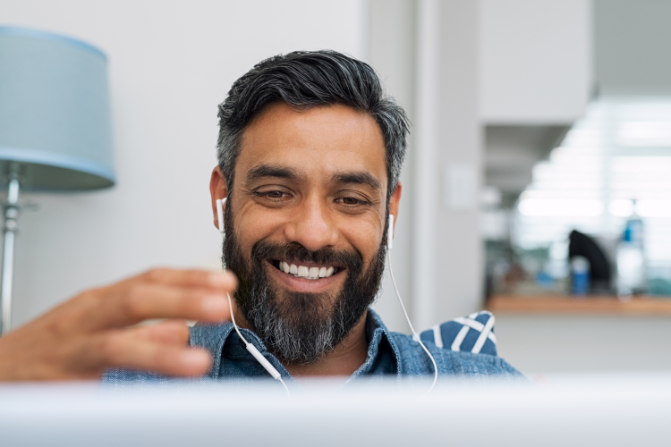 man chatting on video call on his laptop