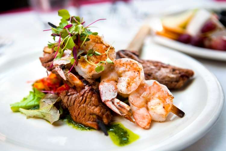 gourmet surf and turf course with shrimp and steak