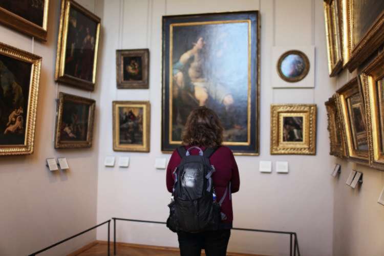 Woman admiring art in a museum