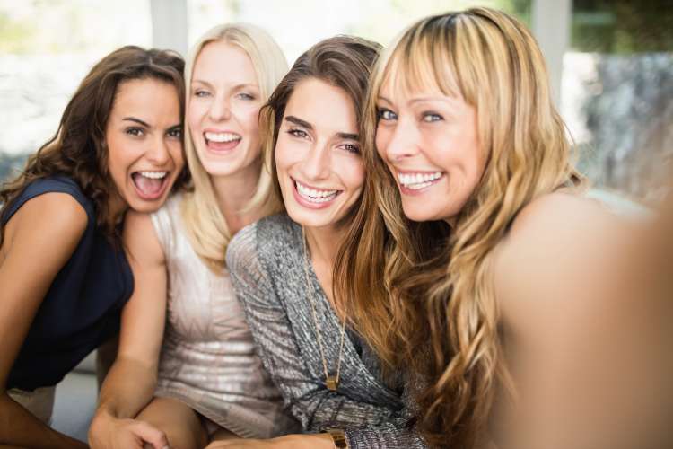 group of women laughing together