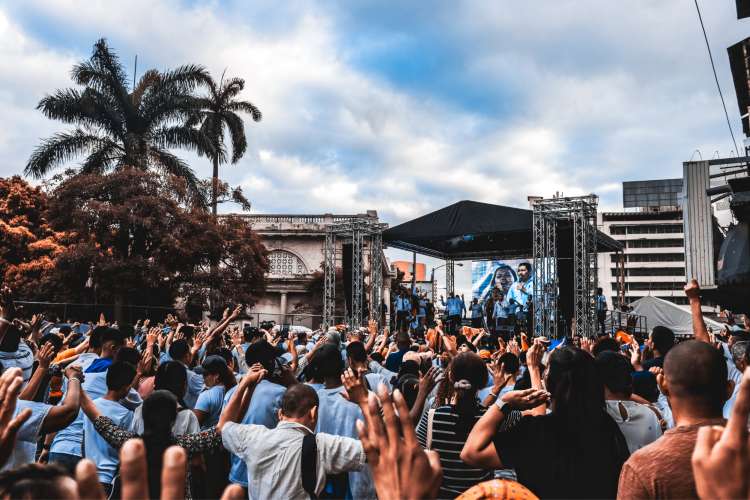 crowd attending concert during the day