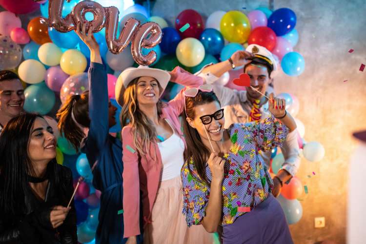 party guests wearing photo booth props