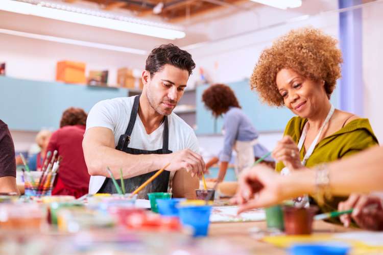 adults making crafts with paint in art classes in Chicago