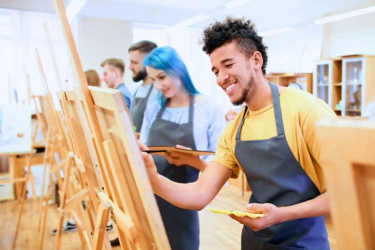 group of young people painting in art classes in Atlanta