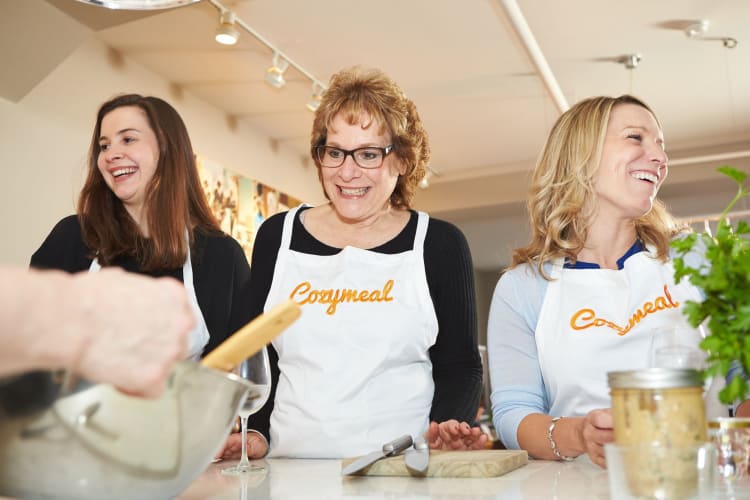 A group do a cooking class together as a team building activity