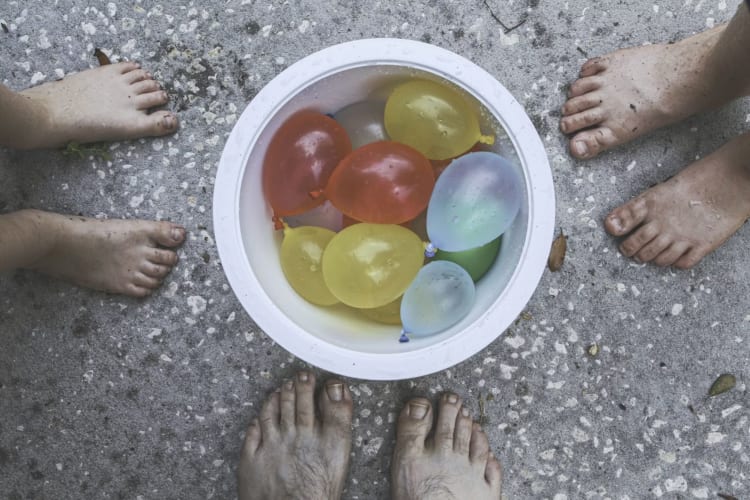 a water balloon fight is a fun activity to do with family