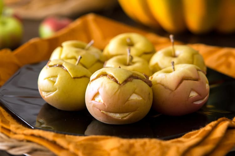 peanut butter apple lanterns are healthy halloween desserts that will light up the party