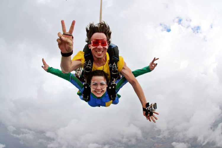 Two people skydiving tandem.