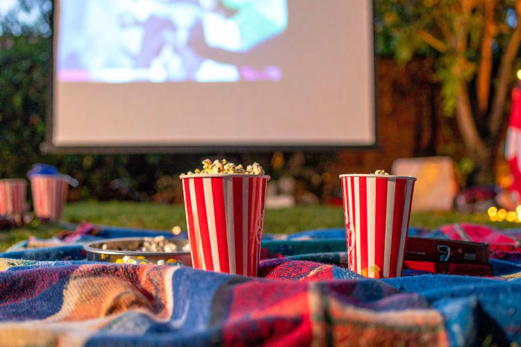 Popcorn on a blanket at an outdoor movie