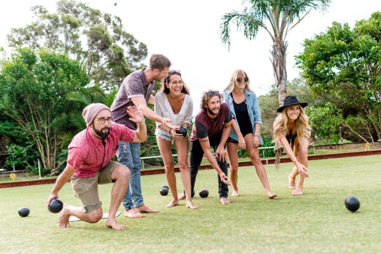 People playing lawn games on the grass