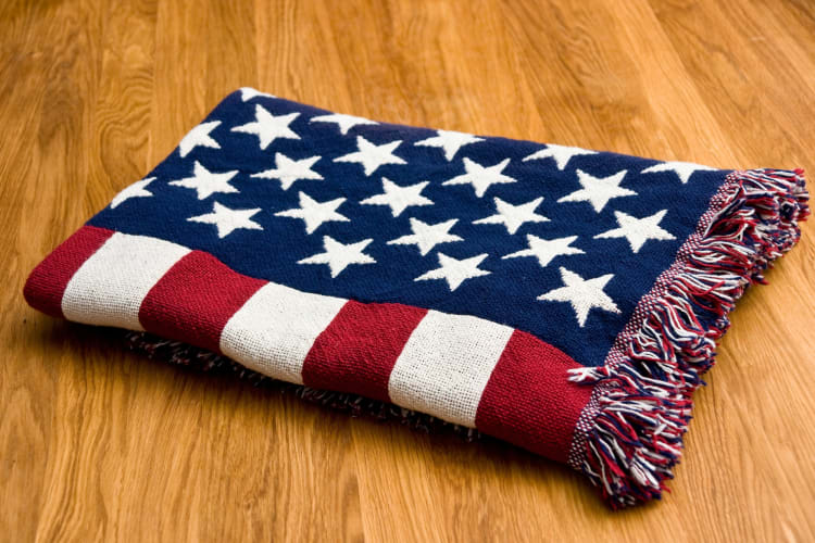 Putting down US flag blankets is a great 4th of July party picnic idea