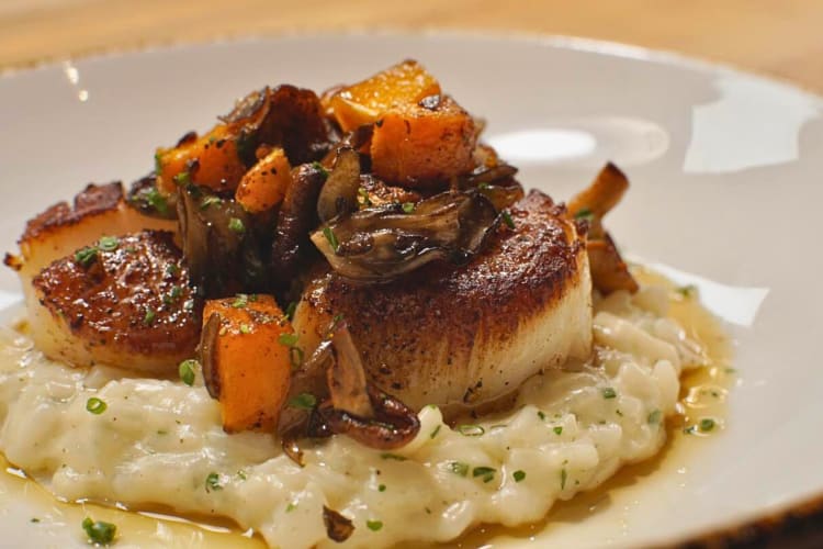 Scallops topped with vegetables from 61 Osteria