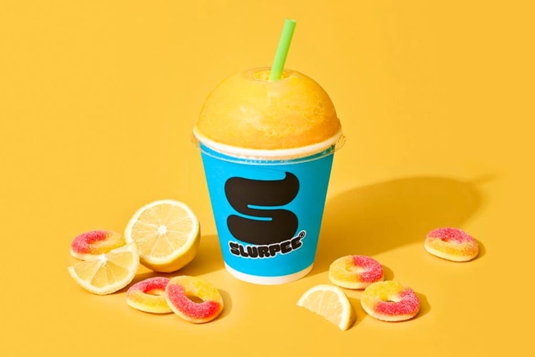 A Slurpee surrounded by peach ring candy and lemon slices