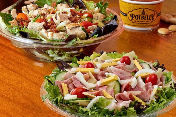 Two salads with a variety of different ingredients, from Potbelly