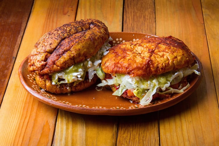Two Mexican-style sandwiches on a plate