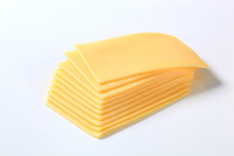 Slices of cheese stacked