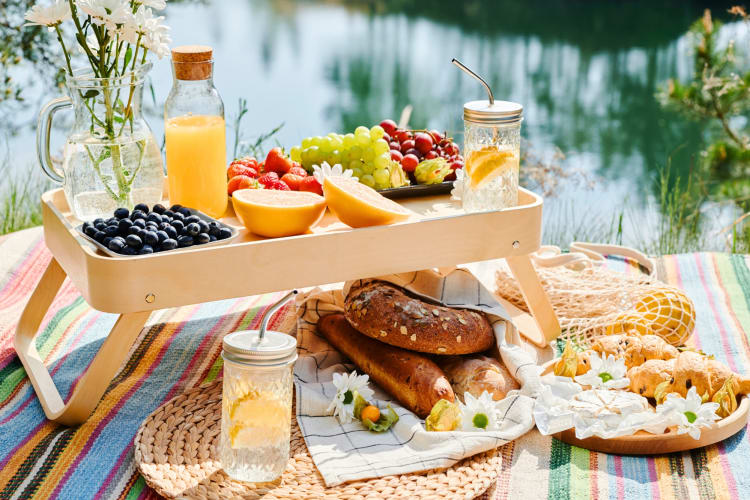 A picnic setup next to a lake