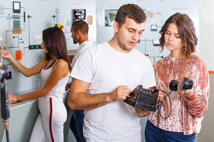 Four people doing an escape room game