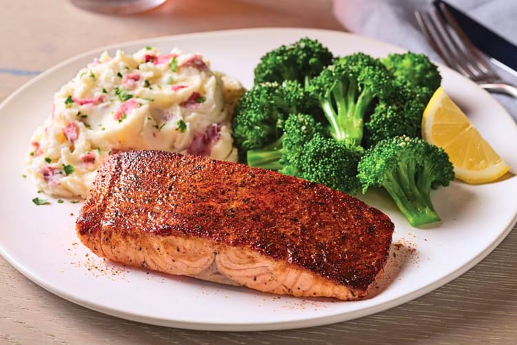 Blackened Cajun salmon, broccoli and mashed potato from Applebee’s, a restaurant open on Christmas Day