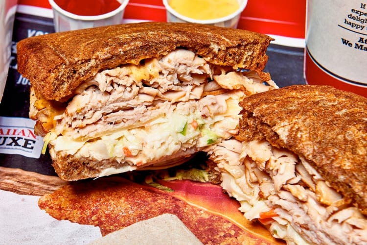 A Reuben sandwich with sliced turkey