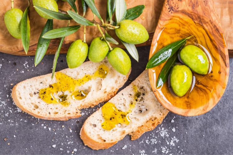 Green olives, olive oil and bread