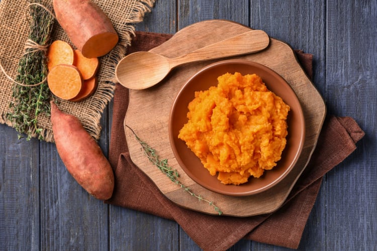 A bowl of mashed sweet potato.