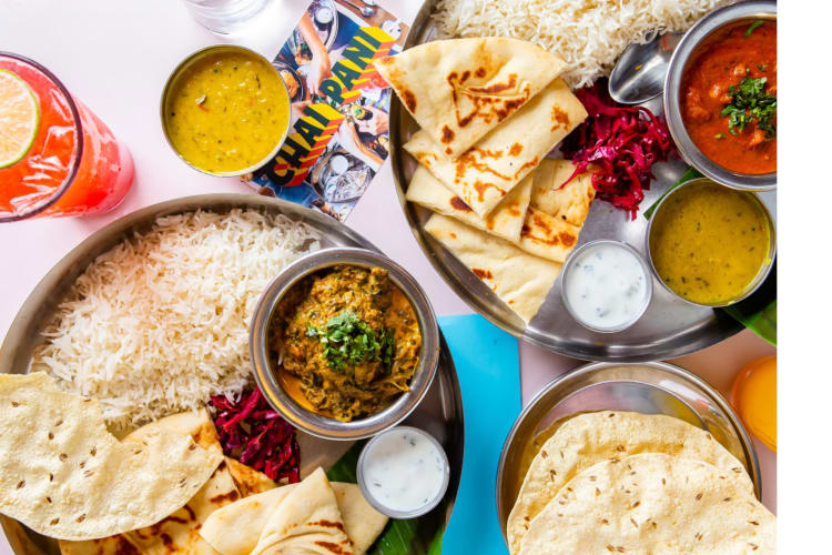 Indian food dishes on a table