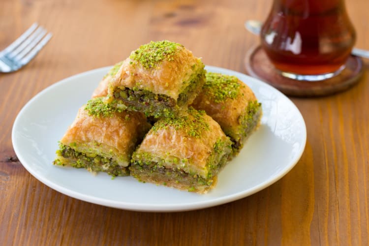 A plate with five pieces of baklava