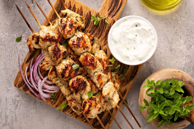 Chicken souvlaki on a board