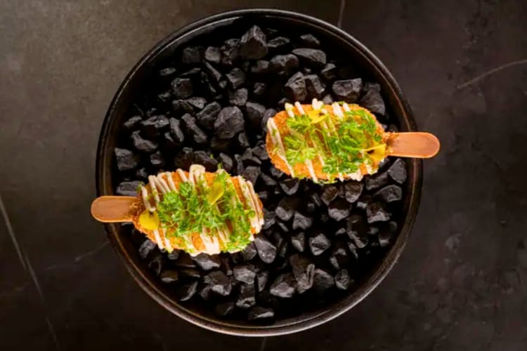 Two panko-coated savory lollipops