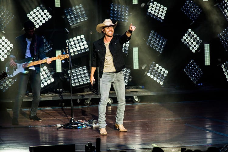 A singer and guitarist performing on stage at The Anthem