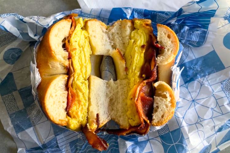 This stuffed breakfast bagel featuring eggs and bacon is a favorite breakfast in Detroit for locals. 