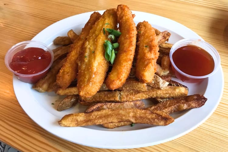 Juicy buttermilk chicken with fries is an iconic breakfast in Detroit.