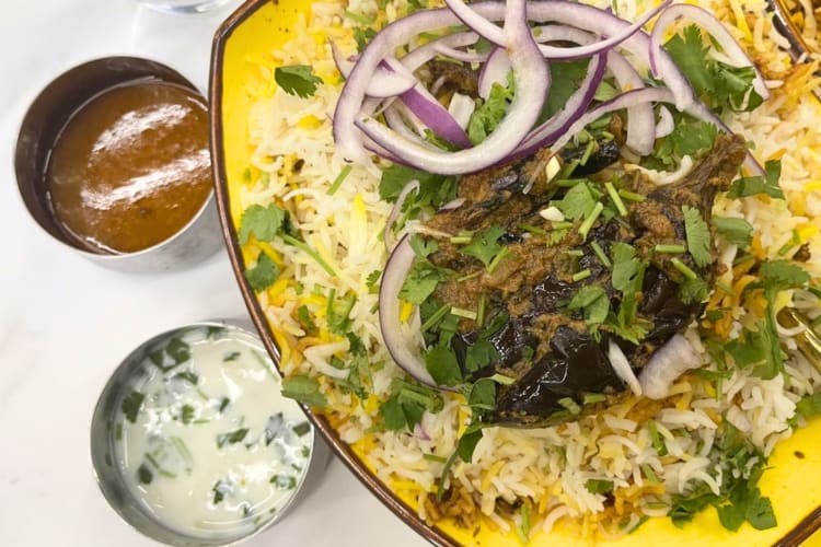 A spicy curry with sauce and rice can be found at this Indian restaurant in Austin. 