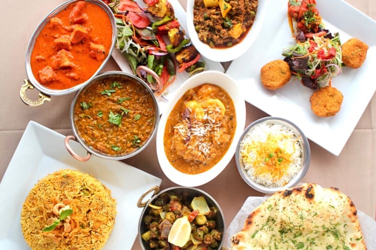 A variety of the fresh cuisine including the butter chicken. 