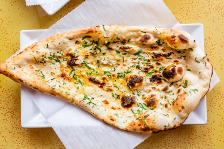 Try this spiced cheesy garlic naan at this Indian restaurant in Boston. 