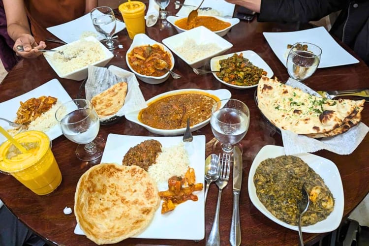 Try the thali, a selection of small plates with various curries and naan breads