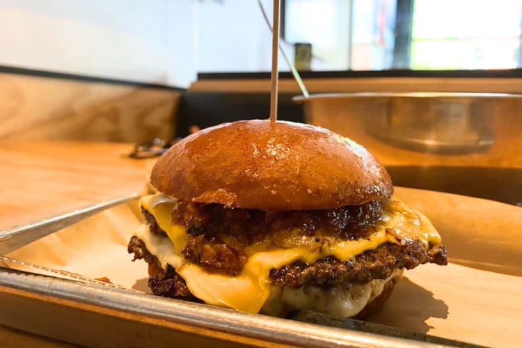 A bacon jam double cheese burger is available at this fast food joint in Austin. 