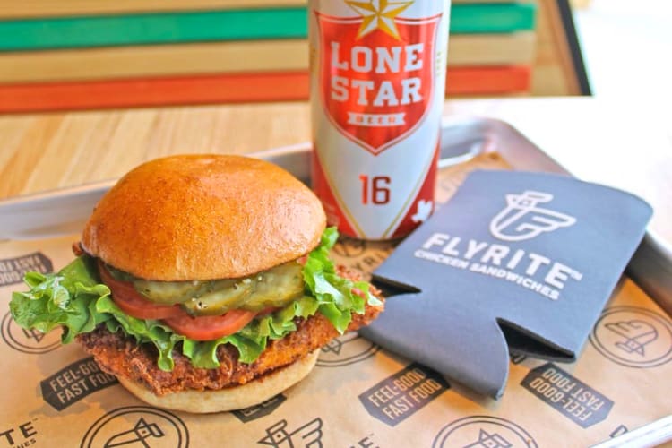 A fried chicken burger, fries and a drink are available at this fast food place in Austin. 