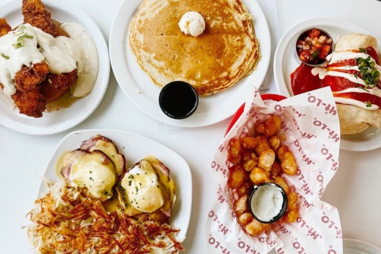 Pancakes, eggs Benedict, hash browns and chicken wings.