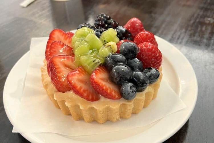 Get this bright fruit tart topped with strawberries, kiwi, blueberries, blackberries and raspberries for breakfast in Minneapolis. 