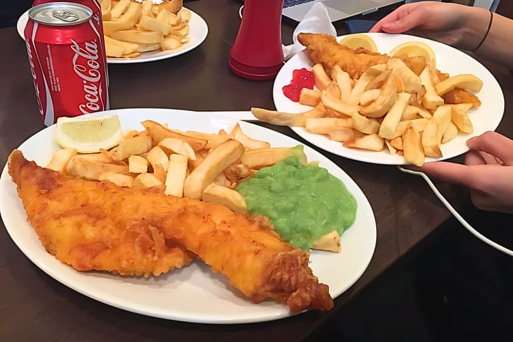 Fried haddock and chips with mushy peas is a classic fish & chip meal in London. 