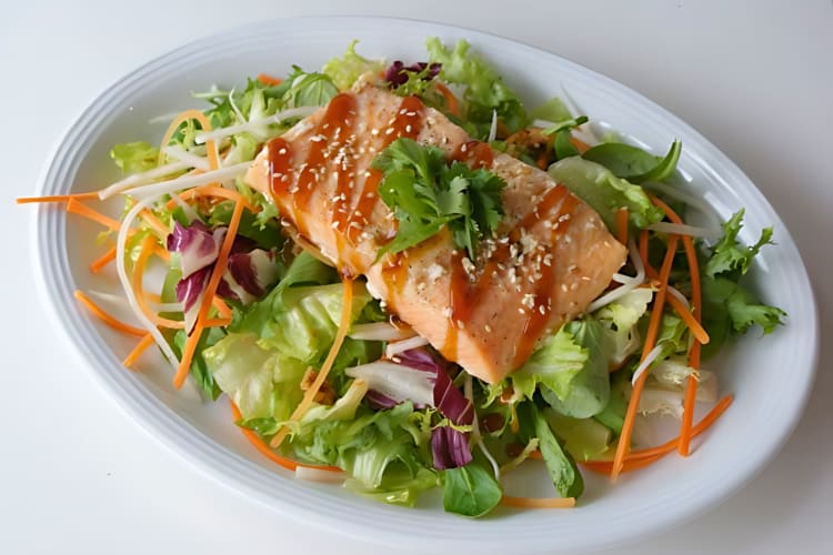 Grilled salmon with sesame seeds and teriyaki sauce.