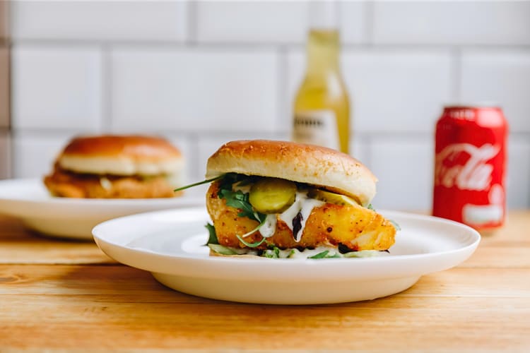 Try a juicy chicken burger at this fish & chip spot in London. 