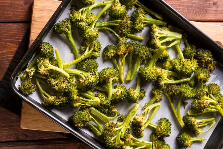 Roasted broccoli on an oven tray. 