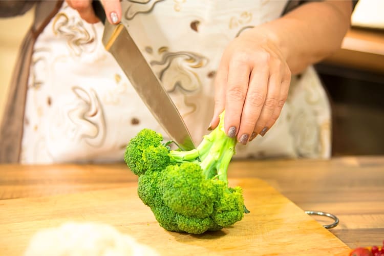 Chopping broccoli. 