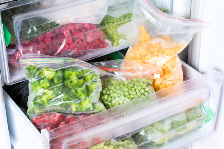 Broccoli and other frozen fruit and vegetables in the freezer.