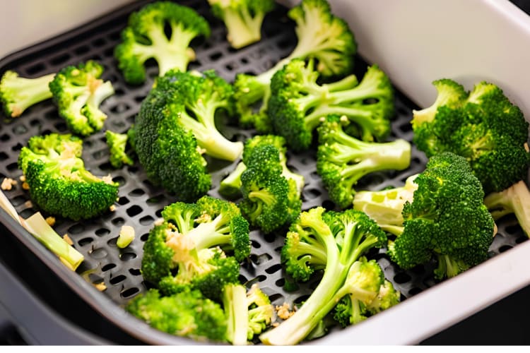 Cooking frozen broccoli and other vegetables in a pan. 