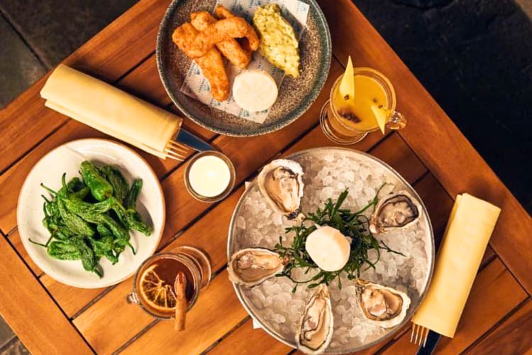 Order oysters, fried shrimp and peppers at this romantic restaurant in London. 